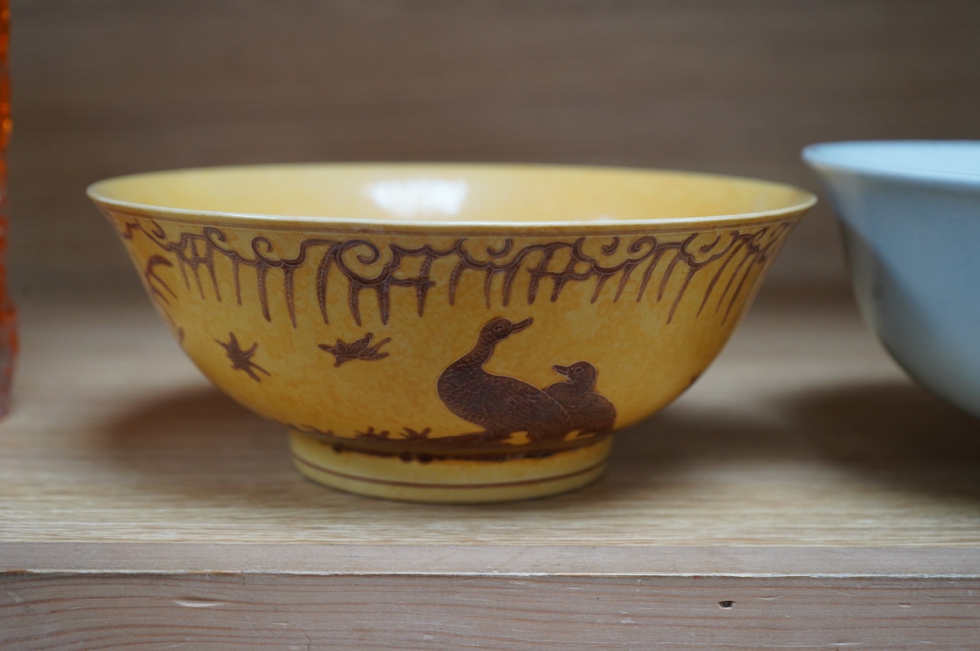 A Chinese celadon bowl and a fine yellow and brown decorated bowl, yellow bowl 9cm diameter. Condition - good